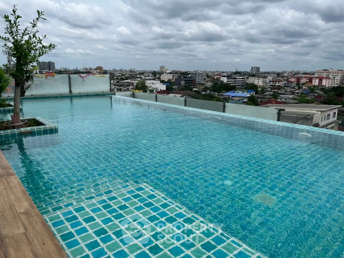 Stunning rooftop infinity pool with panoramic city views, perfect for luxury living.