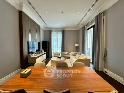 Elegant living room with modern decor and large windows in luxury apartment.
