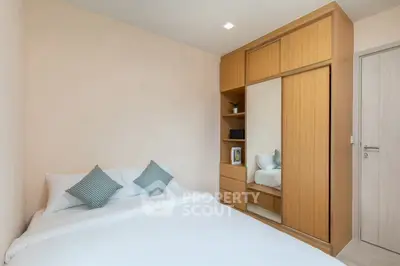 Cozy bedroom with wooden wardrobe and modern decor