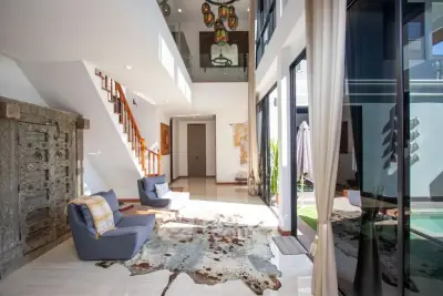 Luxurious modern living room with high ceilings and elegant decor