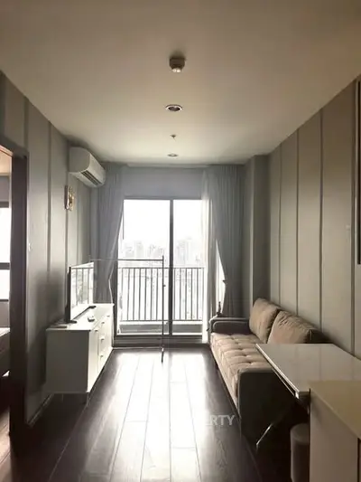 Modern living room with balcony view in high-rise apartment