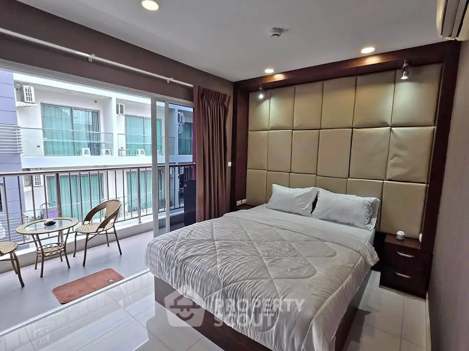 Modern bedroom with balcony access in a stylish apartment