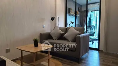 Modern living room with cozy sofa and stylish decor in a contemporary apartment.