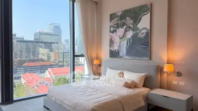 Luxurious bedroom with stunning city view and elegant decor