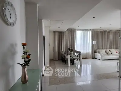 Spacious modern living room with elegant dining area and large windows