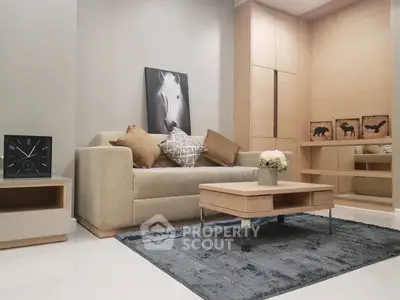Modern living room with stylish decor and comfortable seating in a cozy apartment.