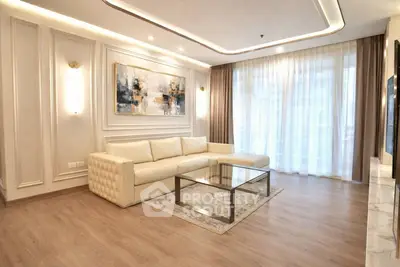 Luxurious modern living room with elegant decor and large windows