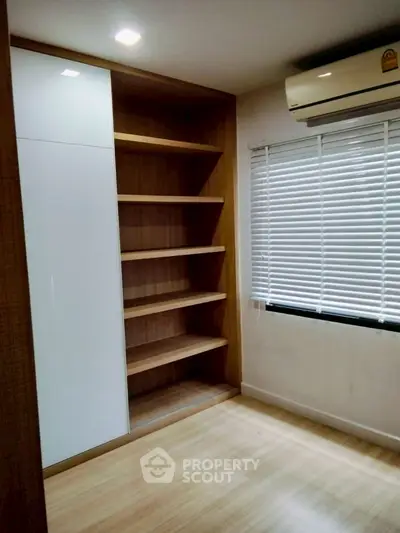 Modern storage room with built-in shelves and air conditioning