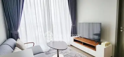 Modern living room with elegant curtains and sleek TV setup