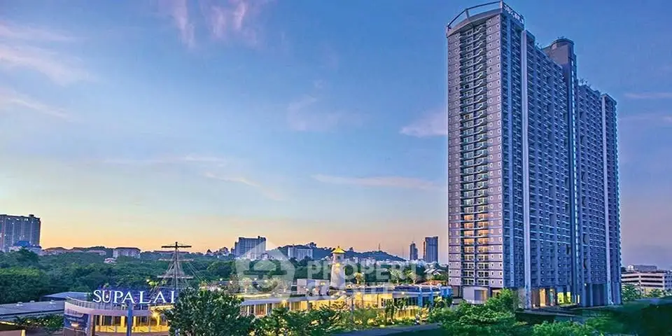 Stunning high-rise building with panoramic city views at sunset, ideal for urban living.