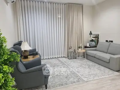 Elegant living room with modern gray furniture and stylish decor