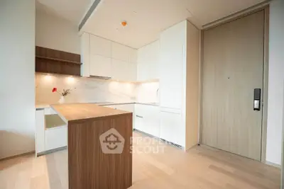 Modern minimalist kitchen with wooden island and sleek cabinetry