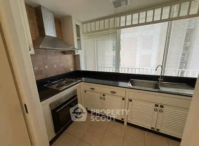 Charming kitchen with modern appliances and sleek cabinetry, perfect for culinary enthusiasts.