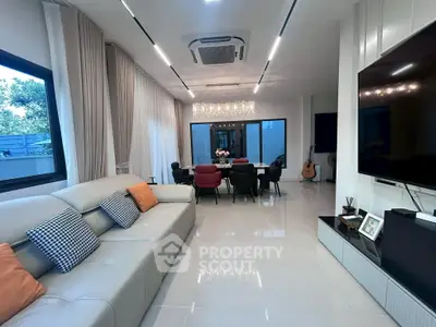 Luxurious modern living room with elegant decor and spacious seating area.