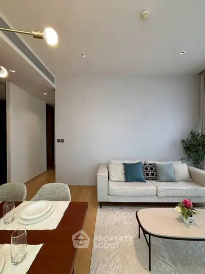 Modern living room with stylish decor and cozy seating area, perfect for relaxation and entertaining.