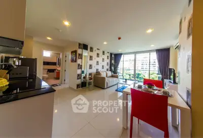 Modern open-plan living room with balcony view and stylish decor