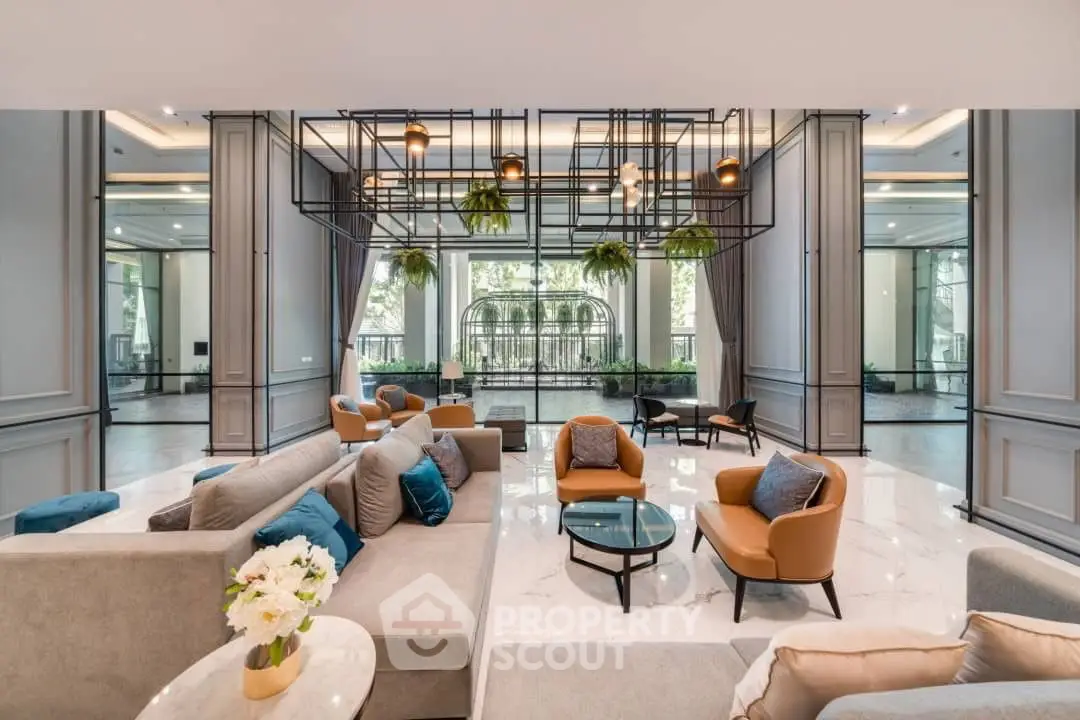 Luxurious modern living room with elegant decor and large windows offering a serene garden view.