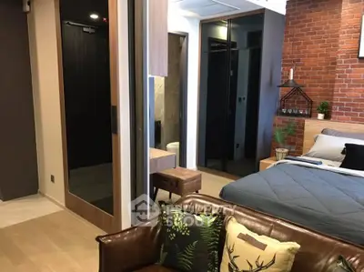 Stylish modern bedroom with exposed brick wall and cozy decor