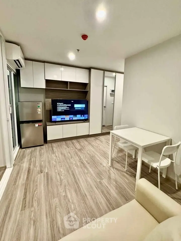 Modern living room with sleek furniture and built-in storage, perfect for urban living.