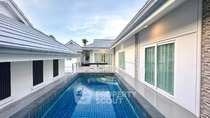 Luxurious modern villa with private pool and sleek architectural design.