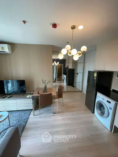 Modern living room with stylish decor and in-unit washing machine