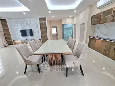 Luxurious modern dining room with elegant marble accents and stylish furniture