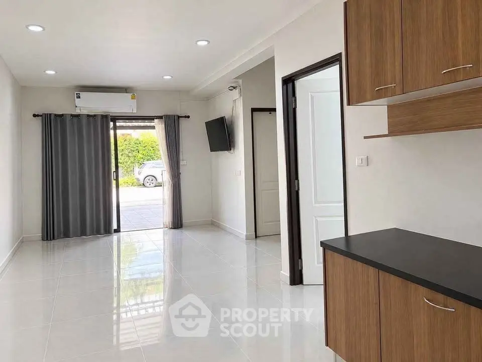 Spacious modern living room with sleek design and ample natural light