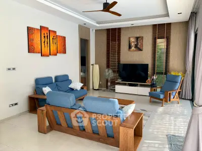 Stylish living room with modern furniture and artistic decor, perfect for relaxation and entertainment.