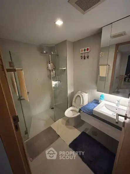 Modern bathroom with glass shower and sleek fixtures