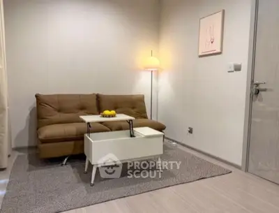 Modern living room with stylish brown sofa and sleek white coffee table