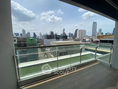 Spacious balcony with stunning city skyline view, perfect for urban living.