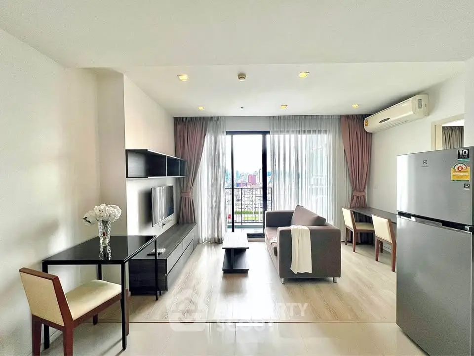 Modern living room with balcony view, sleek furniture, and open layout in a stylish apartment.