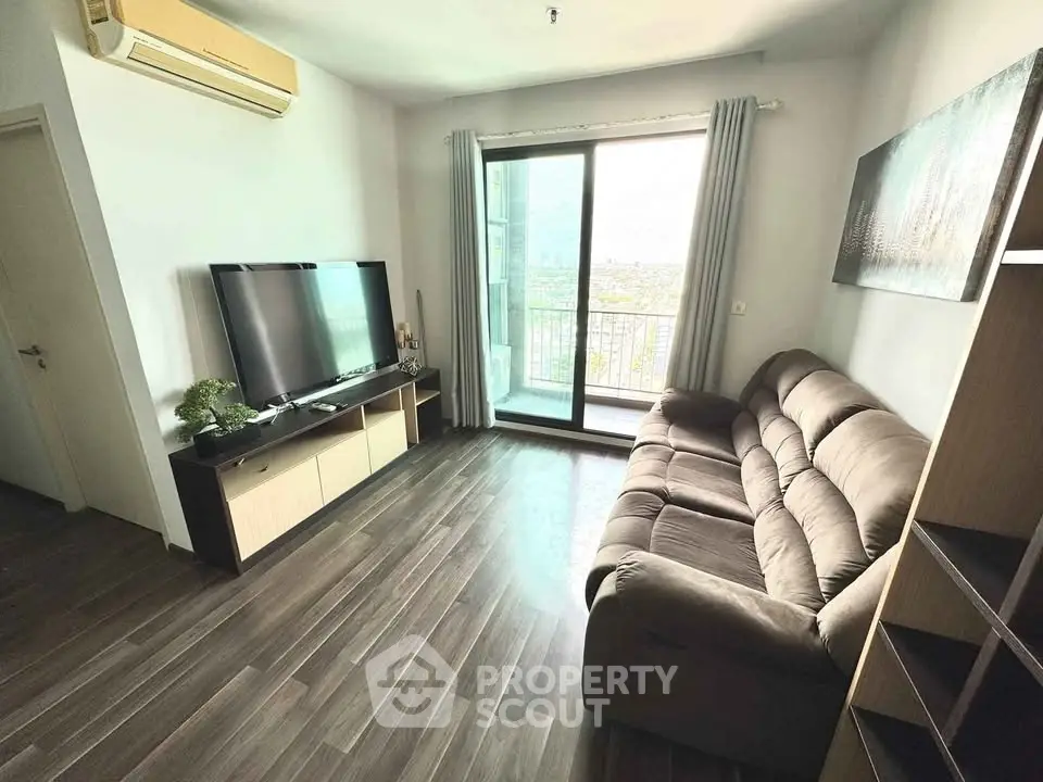 Modern living room with balcony view and sleek furnishings