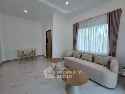 Spacious modern living room with elegant furniture and natural light