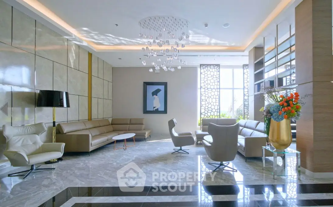 Luxurious modern living room with elegant seating and chandelier