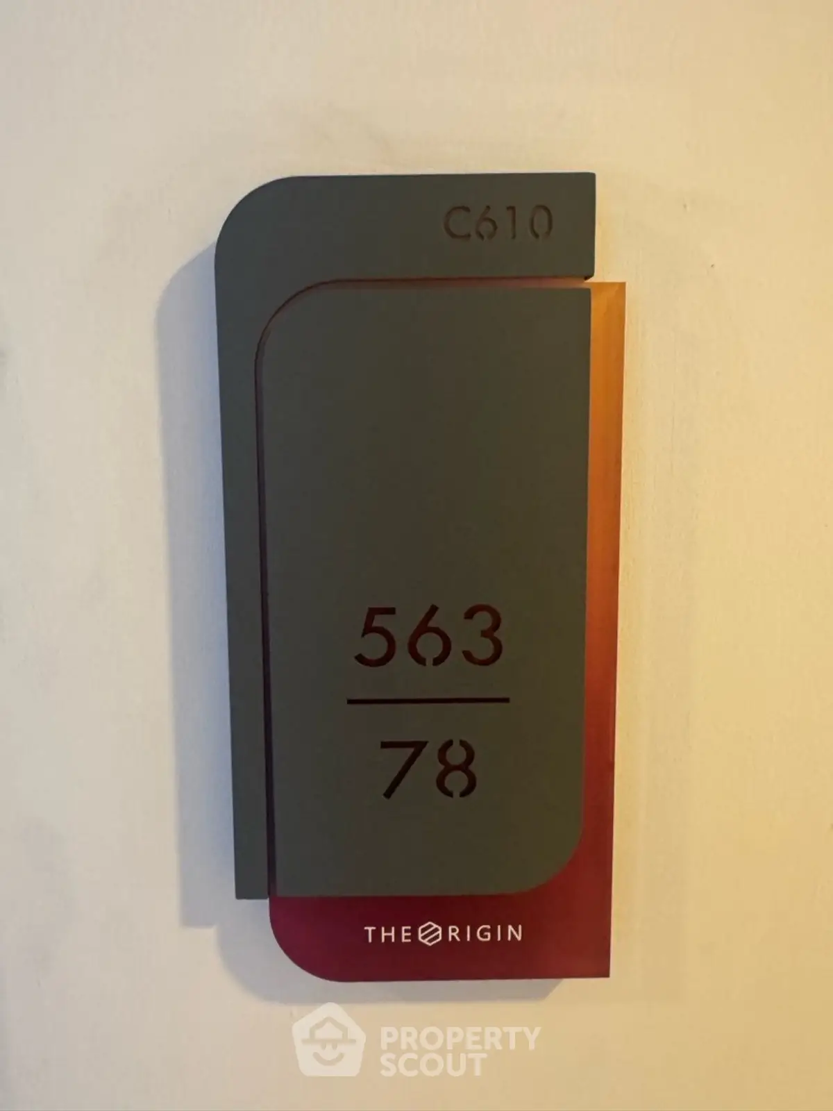 Modern apartment number sign with sleek design and vibrant colors.