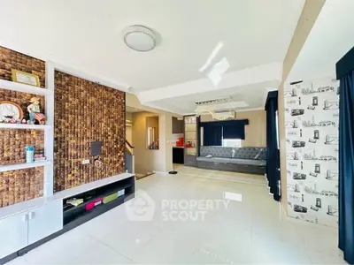 Spacious modern living room with stylish decor and ample natural light