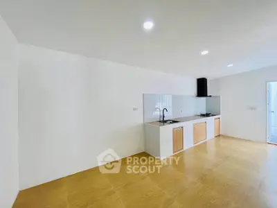 Spacious modern kitchen with sleek design and ample natural light