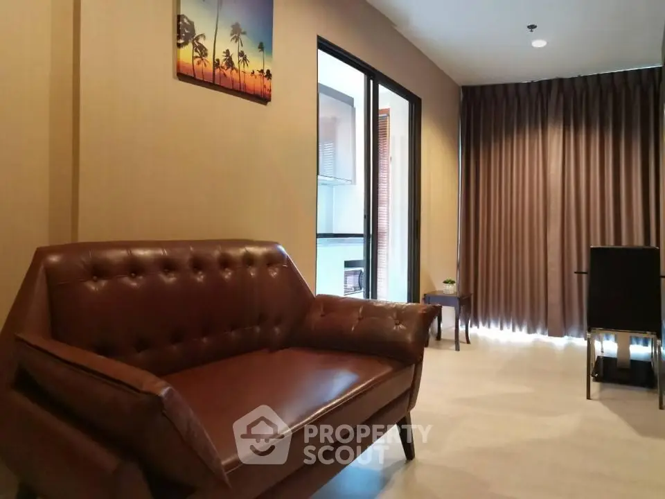 Stylish living room with leather sofa and modern decor in a cozy apartment.