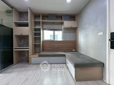 Modern living room with built-in storage and cozy seating area