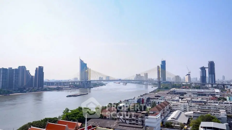 Stunning river view with modern bridge and city skyline