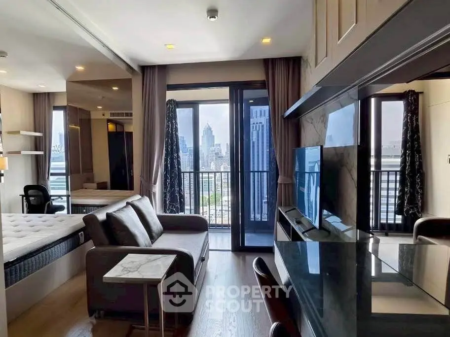 Modern apartment with open living area and stunning city view from balcony.