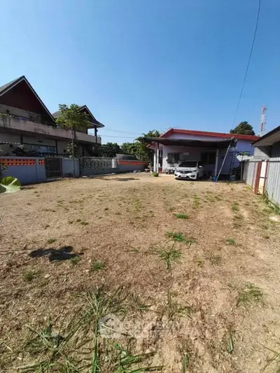 Spacious residential property with ample outdoor space and carport, ideal for development or renovation.