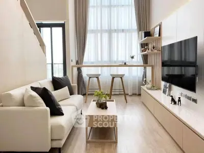 Modern living room with high ceilings and stylish decor
