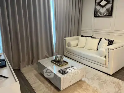 Elegant living room with modern white sofa and marble coffee table