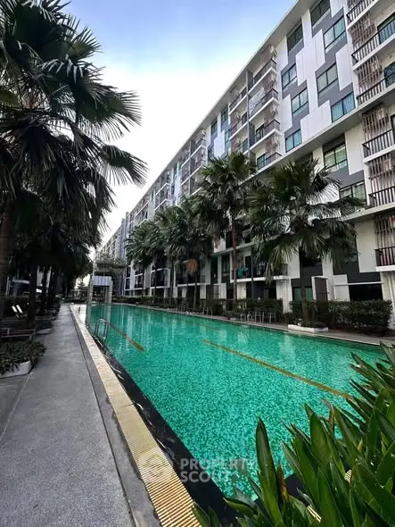 Luxurious condominium with a stunning outdoor pool and modern architecture.