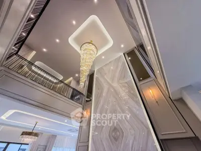 Luxurious interior with grand chandelier and elegant architectural details