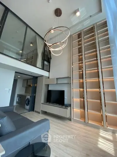 Modern loft apartment with high ceilings, stylish lighting, and open living space.