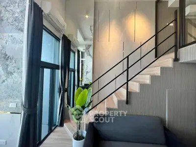 Modern duplex interior with stylish staircase and large windows