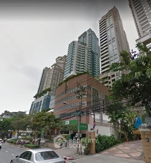 Stunning urban high-rise buildings with lush greenery and modern architecture.